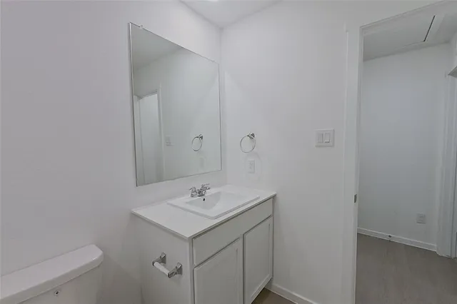 a bathroom with a sink and mirror
