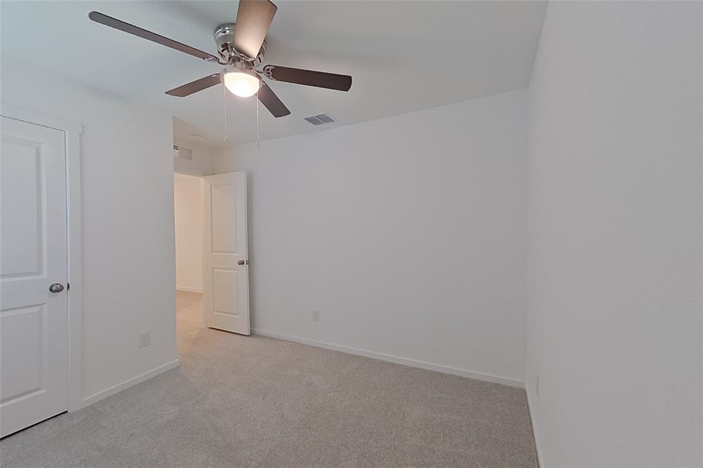 827 Ginkgo Way Princeton, TX 75407 - Photo 13 of 27 en empty room with ceiling fan