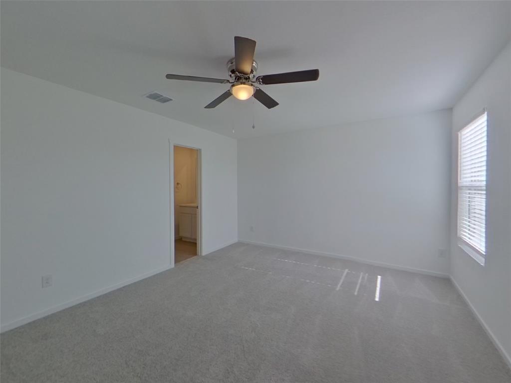 827 Ginkgo Way Princeton, TX 75407 - Photo 22 of 27 an empty room with windows and fan