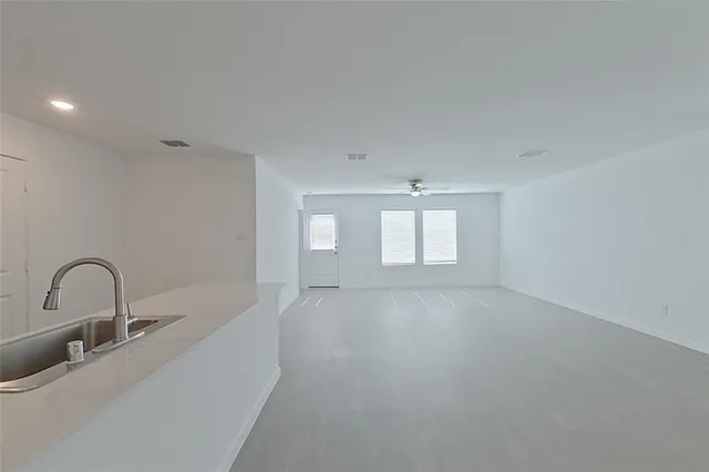 a view of an empty room with a sink