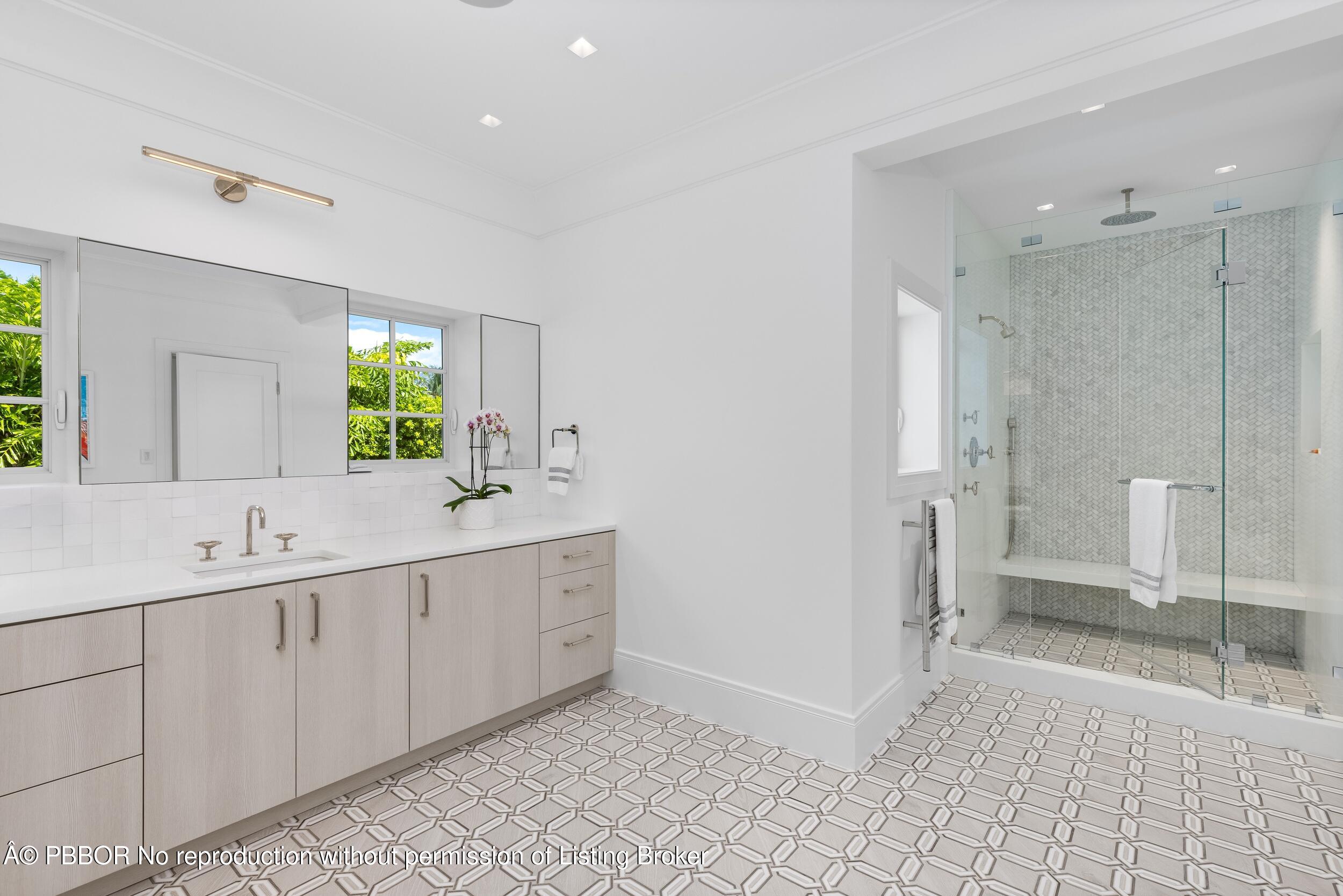 201 Banyan Road Palm Beach, FL 33480 - Photo 19 of 42 a spacious bathroom with a double vanity sink and a mirror