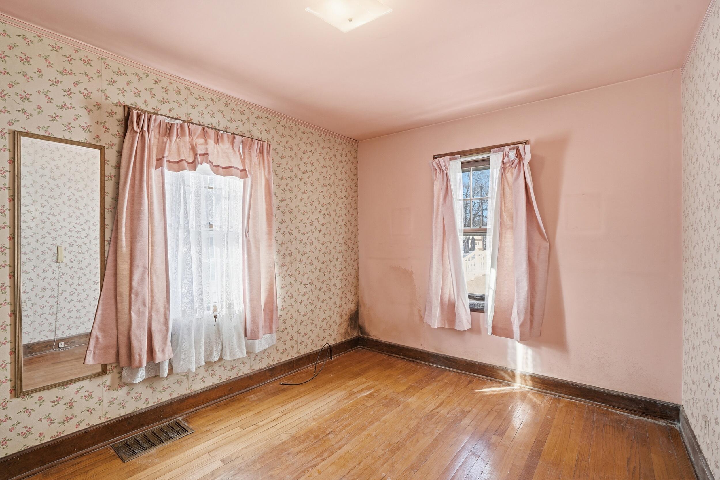 624 North West Street Crown Point, IN 46307 - Photo 14 of 32 an empty room with wooden floor and windows