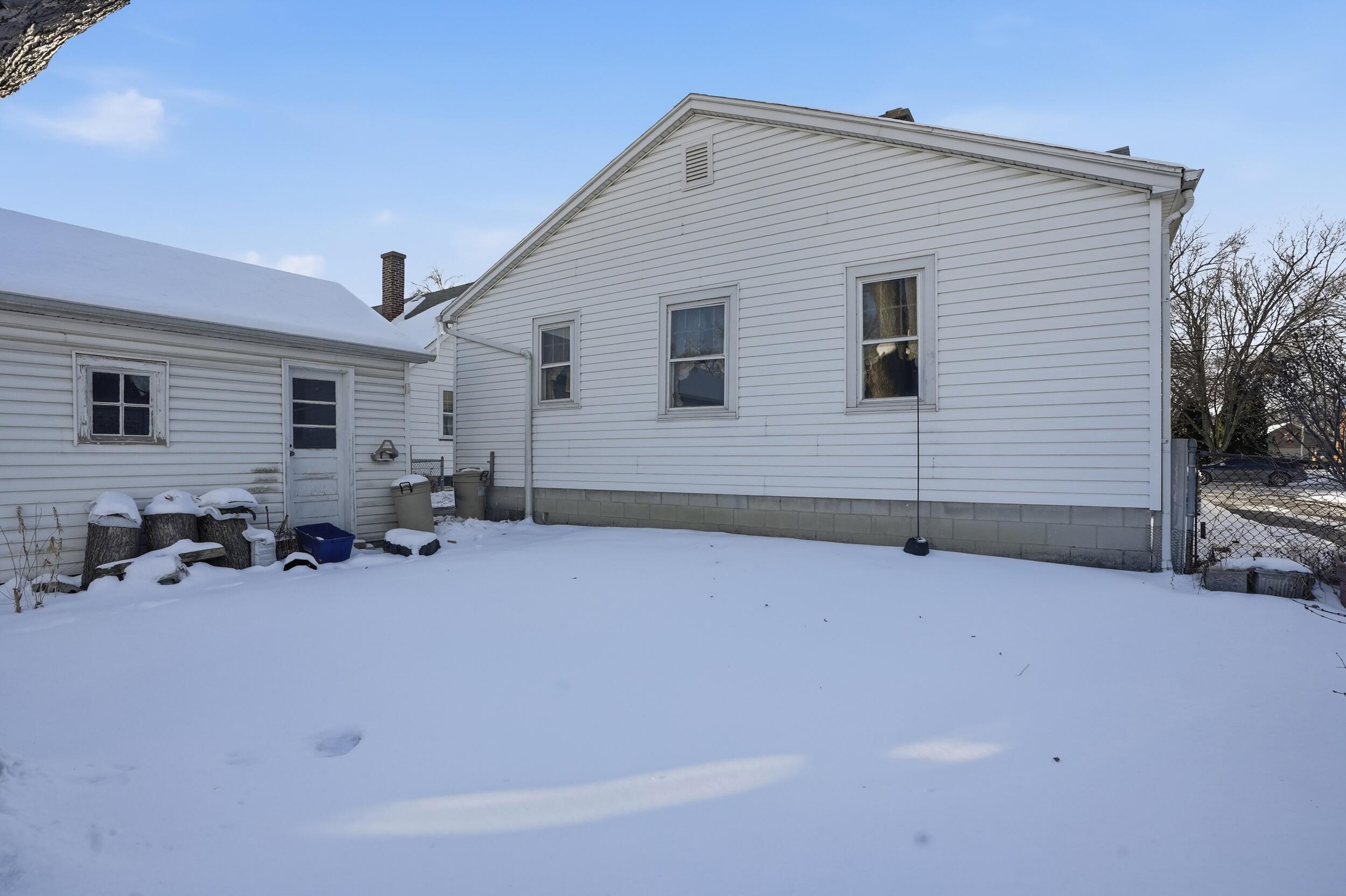 624 North West Street Crown Point, IN 46307 - Photo 24 of 32 a view of a house with yard and sitting area