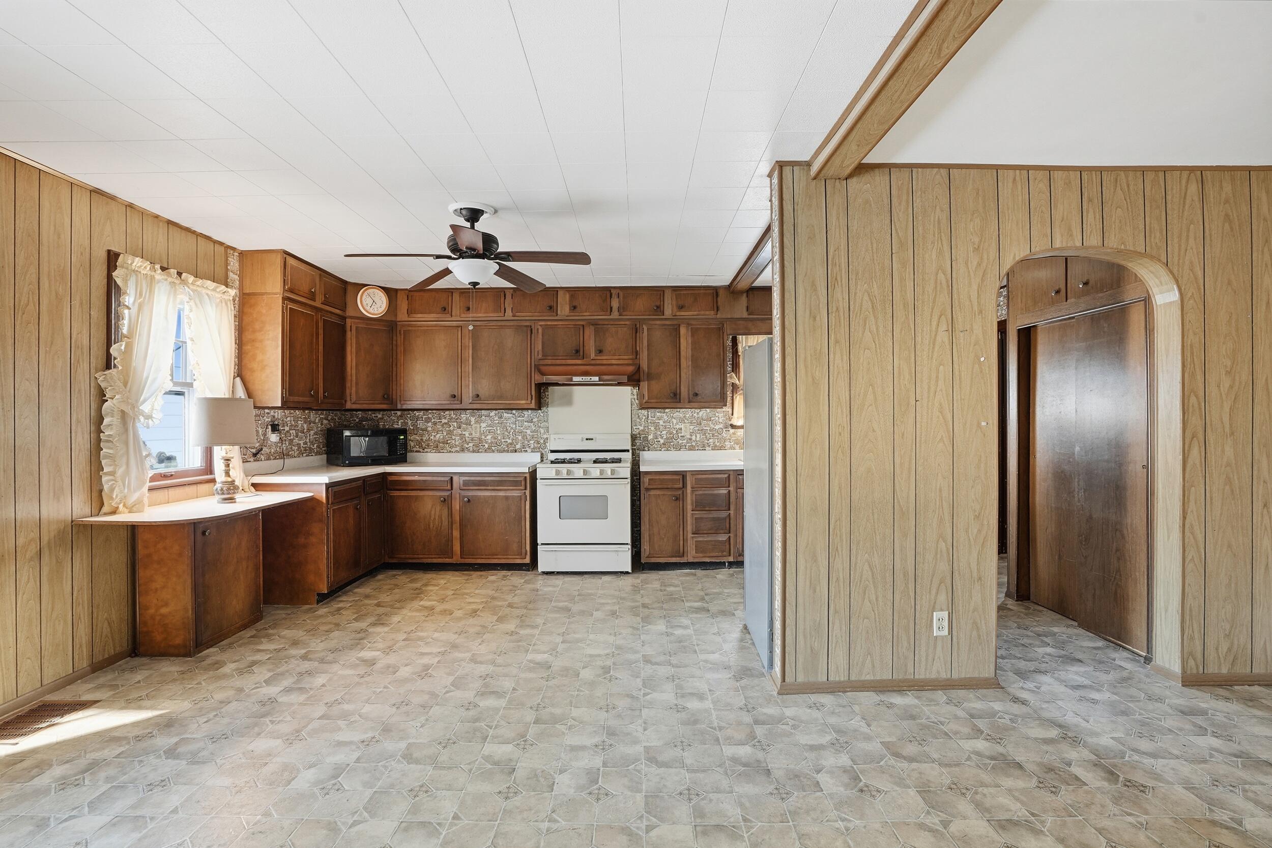 624 North West Street Crown Point, IN 46307 - Photo 7 of 32 a kitchen with stainless steel appliances granite countertop a refrigerator and a sink
