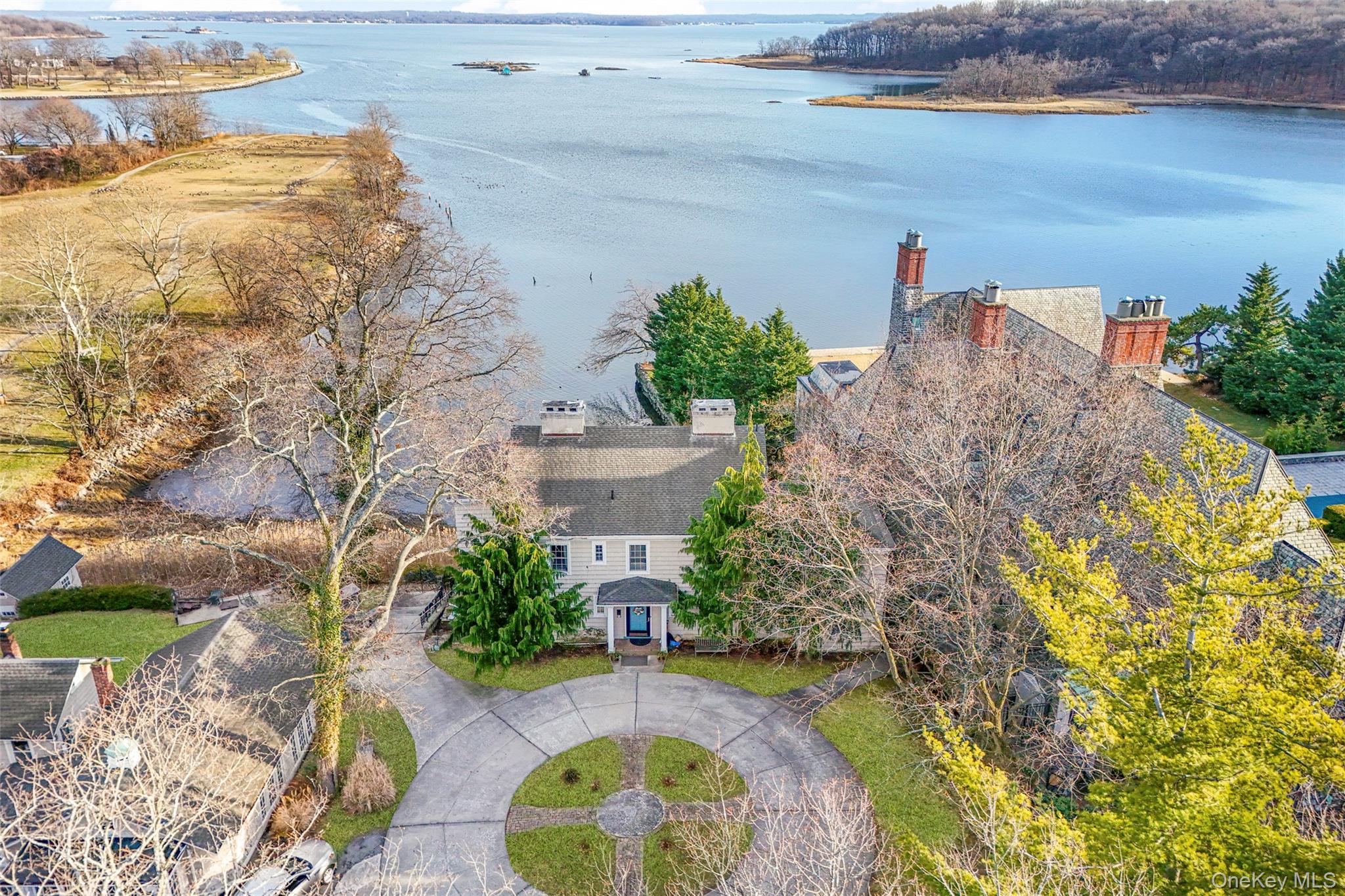 an aerial view of a house with a yard basket ball court