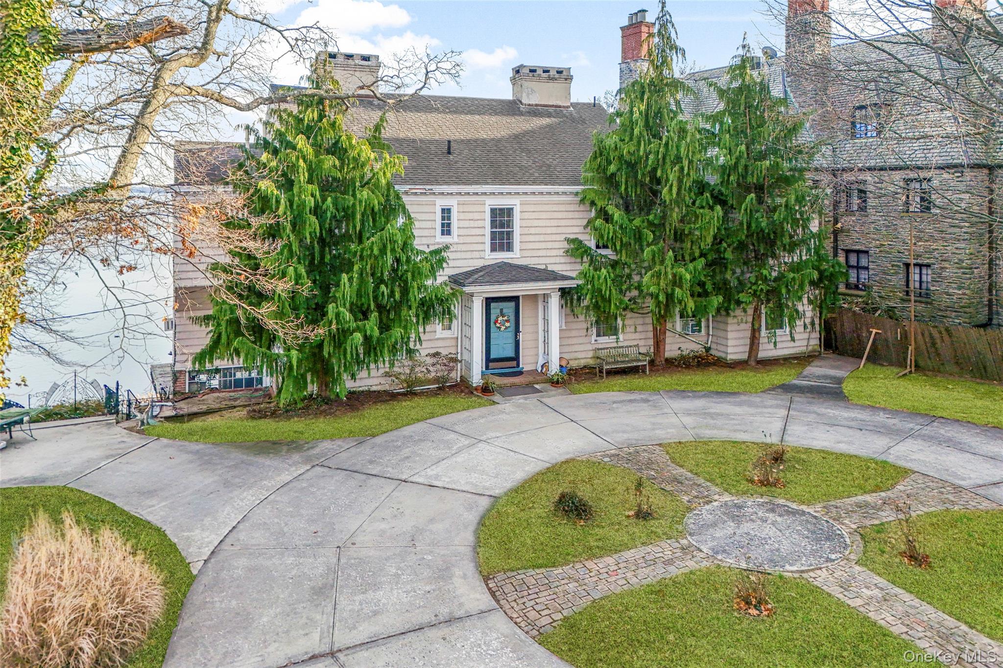 50 Shore Road Pelham, NY 10803 - Photo 15 of 28 a view of swimming pool with sitting area and large trees