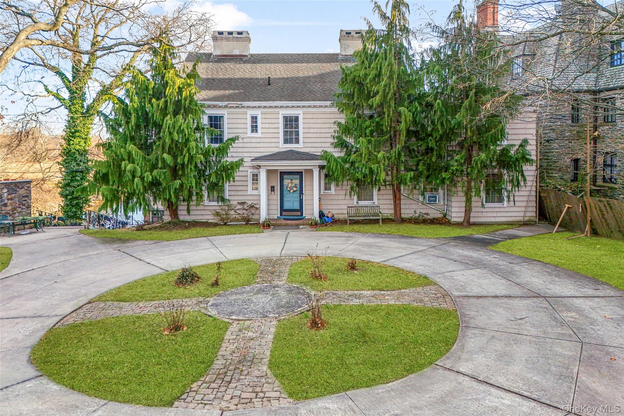 50 Shore Road Pelham, NY 10803 - Photo 3 of 28 a view of a swimming pool with a garden