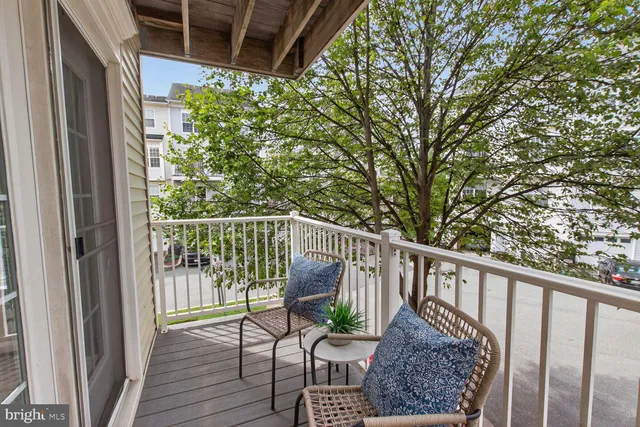 a view of a balcony with wooden floor