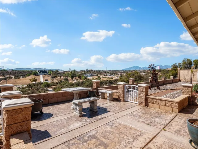 a kitchen with kitchen island granite countertop a sink stainless steel appliances and cabinets