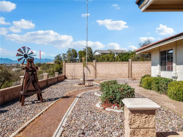 a large kitchen with stainless steel appliances granite countertop a large counter top a sink and cabinets