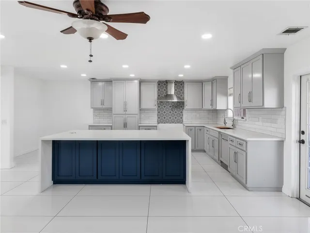 a view of a livingroom with a ceiling fan and window