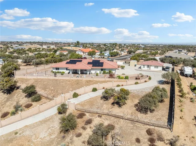 a a patio with table and chairs