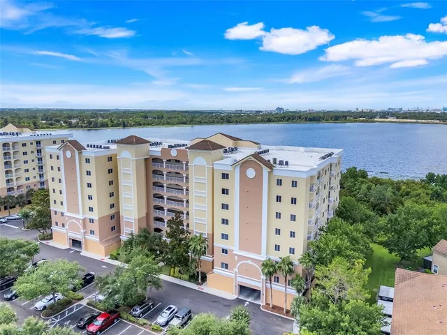 a view of a building with lake view and mountain view