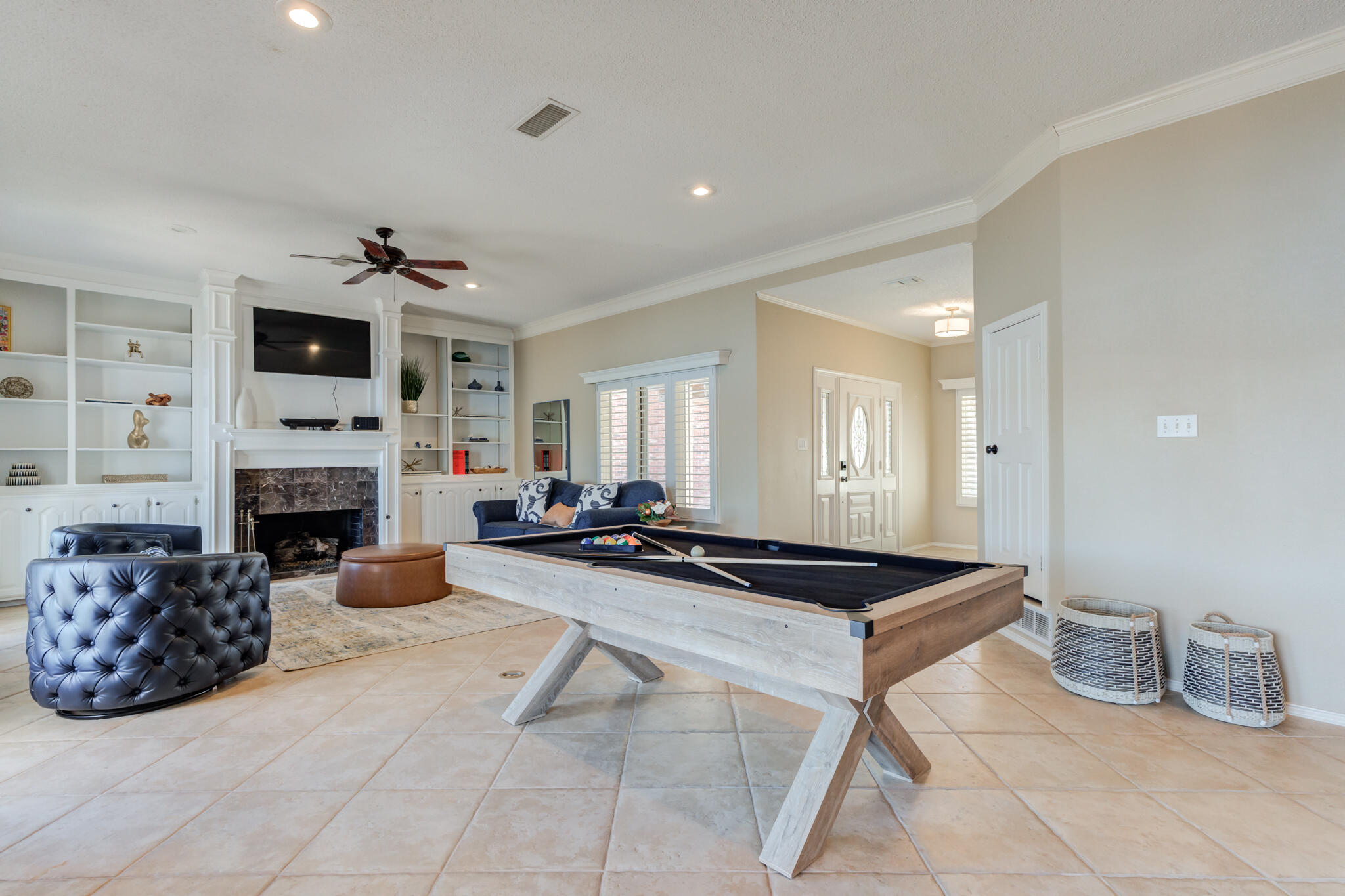 16 South Lake Shore Drive Ransom Canyon, TX 79366 - Photo 26 of 64 a living room with furniture a fireplace and a flat screen tv