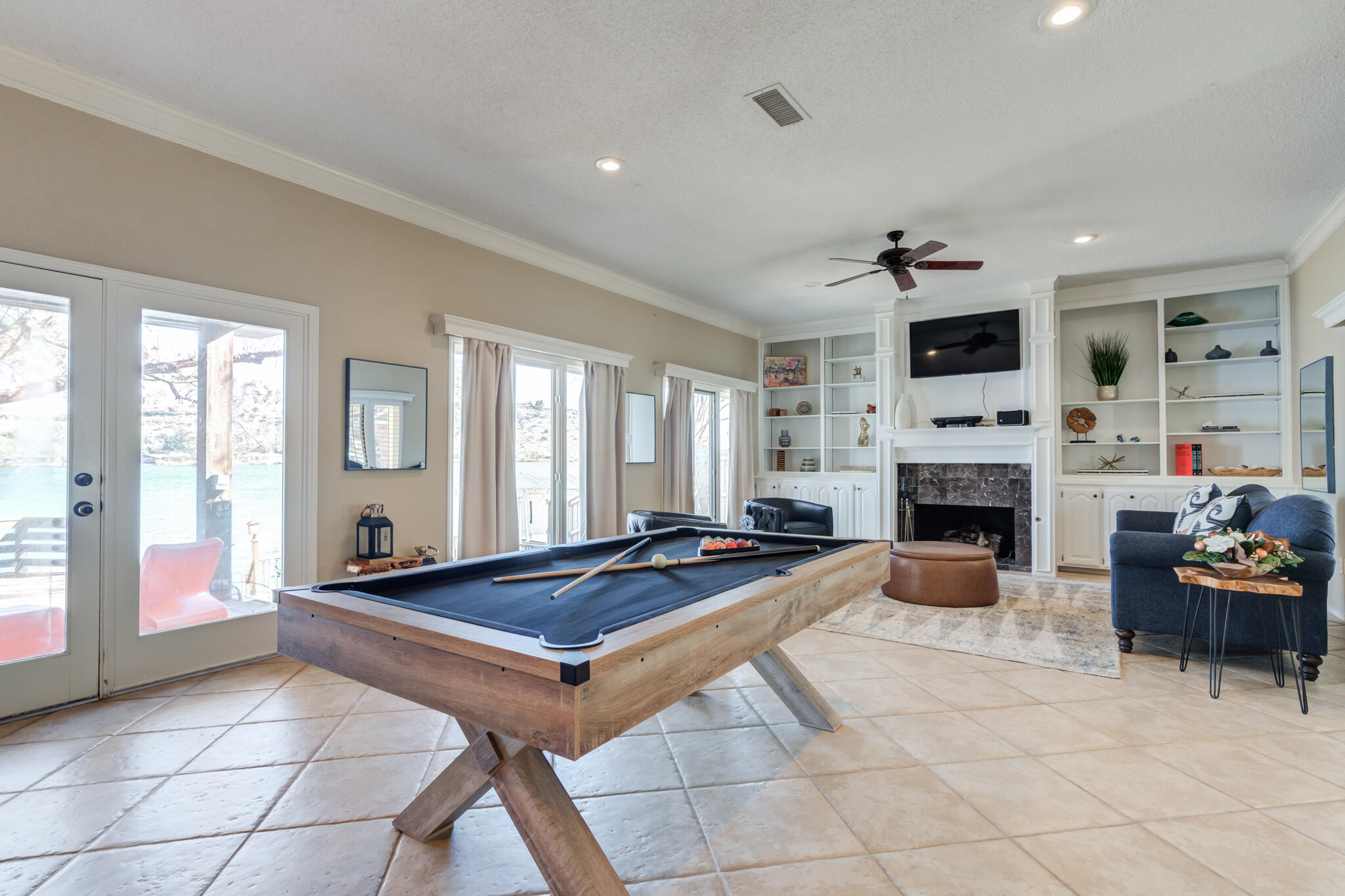16 South Lake Shore Drive Ransom Canyon, TX 79366 - Photo 27 of 64 a living room with fireplace furniture and a flat screen tv