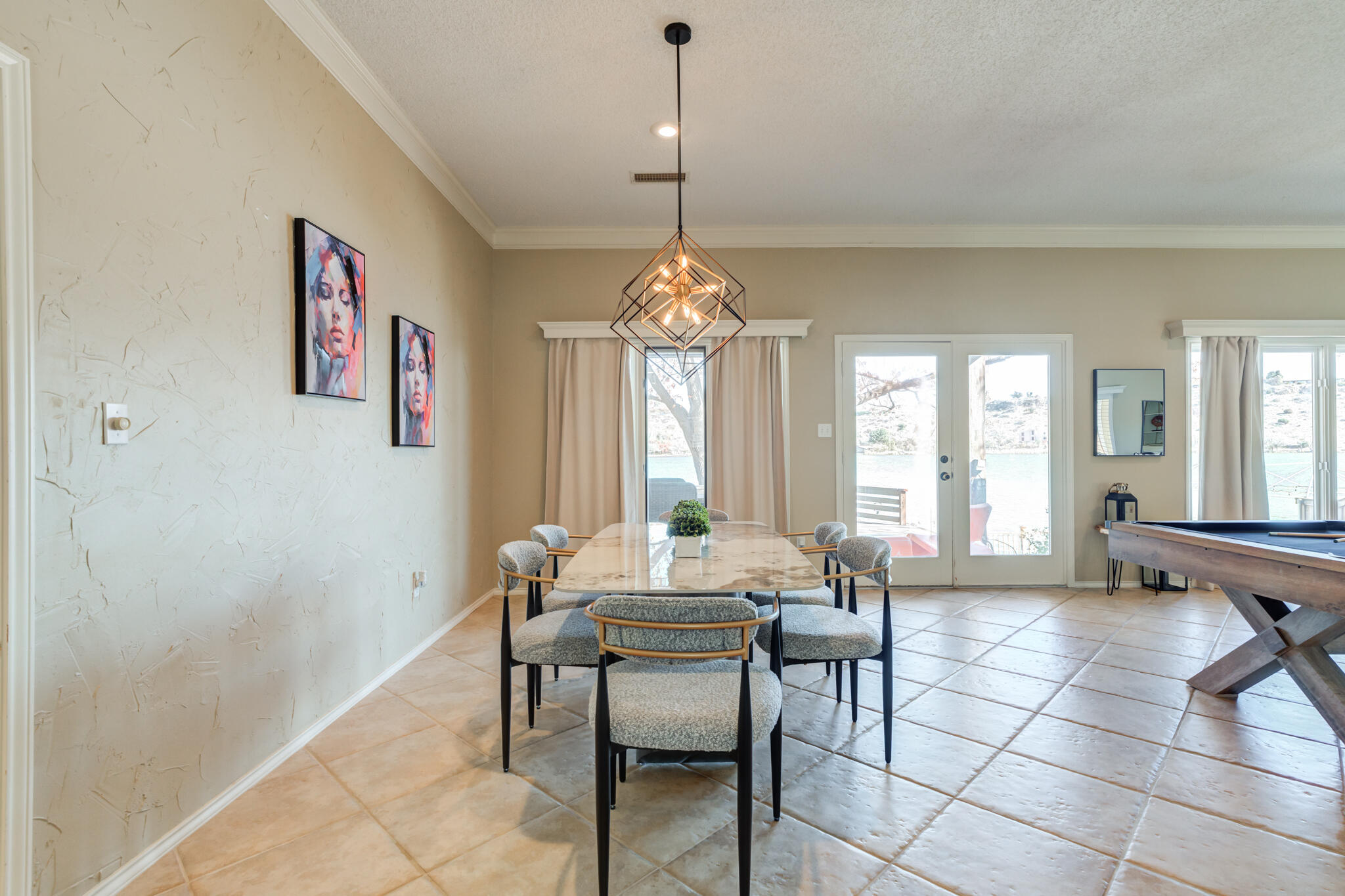 16 South Lake Shore Drive Ransom Canyon, TX 79366 - Photo 29 of 64 a dining room with furniture a window and a chandelier