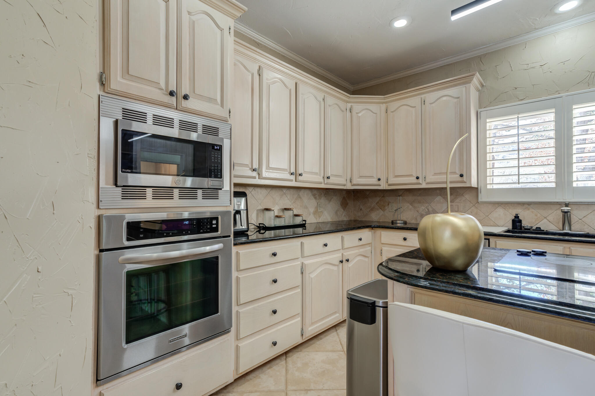 16 South Lake Shore Drive Ransom Canyon, TX 79366 - Photo 32 of 64 a kitchen with cabinets stainless steel appliances a sink and dishwasher with wooden floor