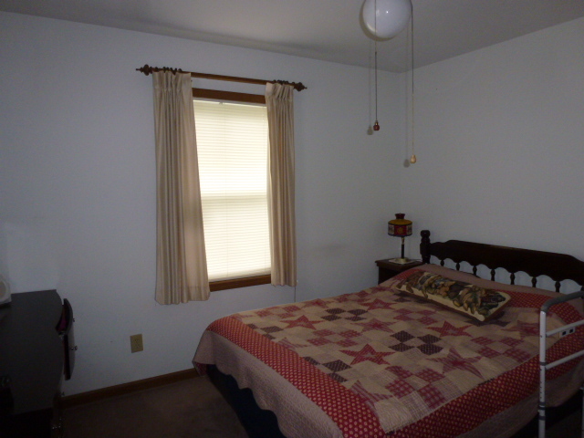 3 Deerefield Court Clinton, IL 61727 - Photo 11 of 29 a bedroom with a bed and window