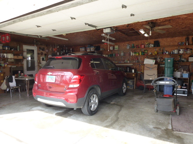 3 Deerefield Court Clinton, IL 61727 - Photo 18 of 29 a car that is parked in a garage