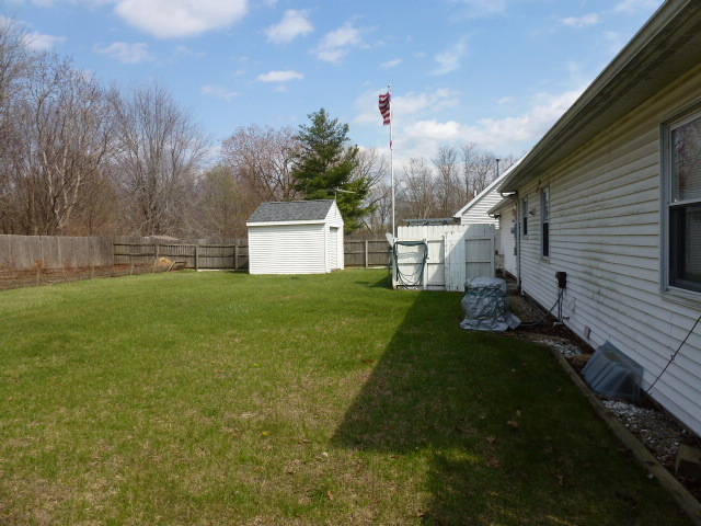 3 Deerefield Court Clinton, IL 61727 - Photo 27 of 29 a view of a back yard of the house with a yard