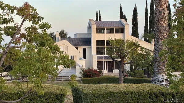 a view of front of house with a yard