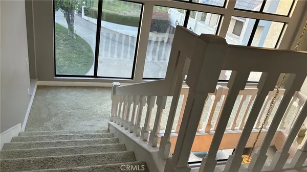 a view of staircase with large window