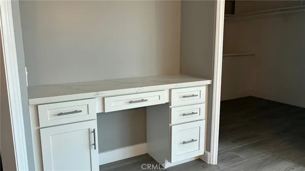 a view of cabinets and wooden floor