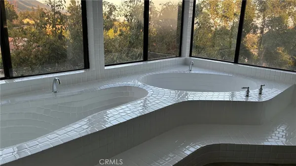 a view of a floor to ceiling window and a sink