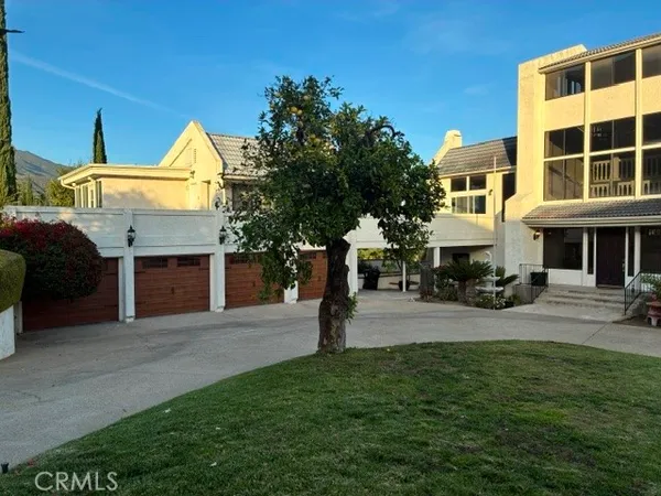 a front view of a building with garden