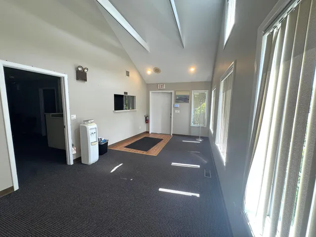 a view of livingroom with furniture and windows