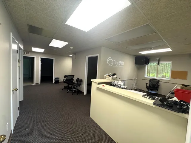 a room with furniture and a large window