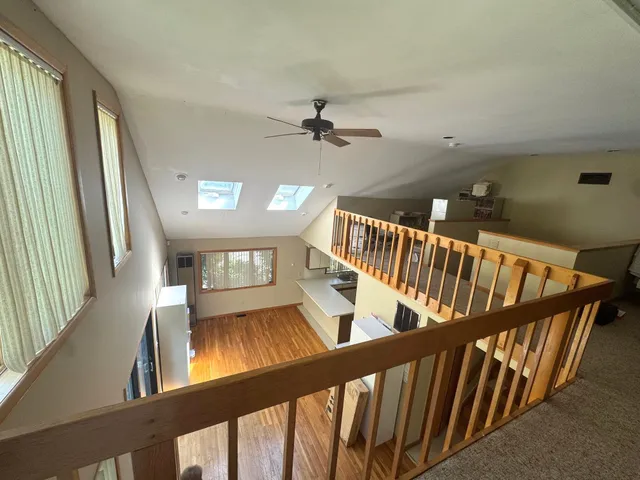 a view of an entryway door with wooden floor