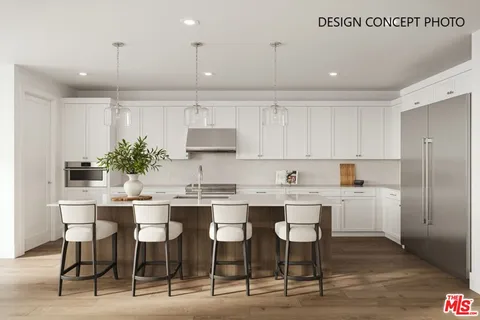 a kitchen with kitchen island granite countertop a table and chairs in it
