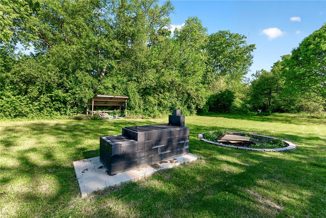 2684 Arthur Road Springfield, OH 45502 - Photo 55 of 69 This spacious yard features a built-in outdoor grill, perfect for entertaining under the open sky.
