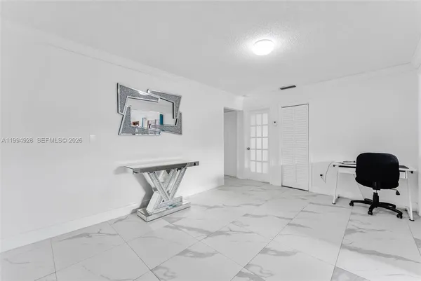 a view of an empty room with a window
