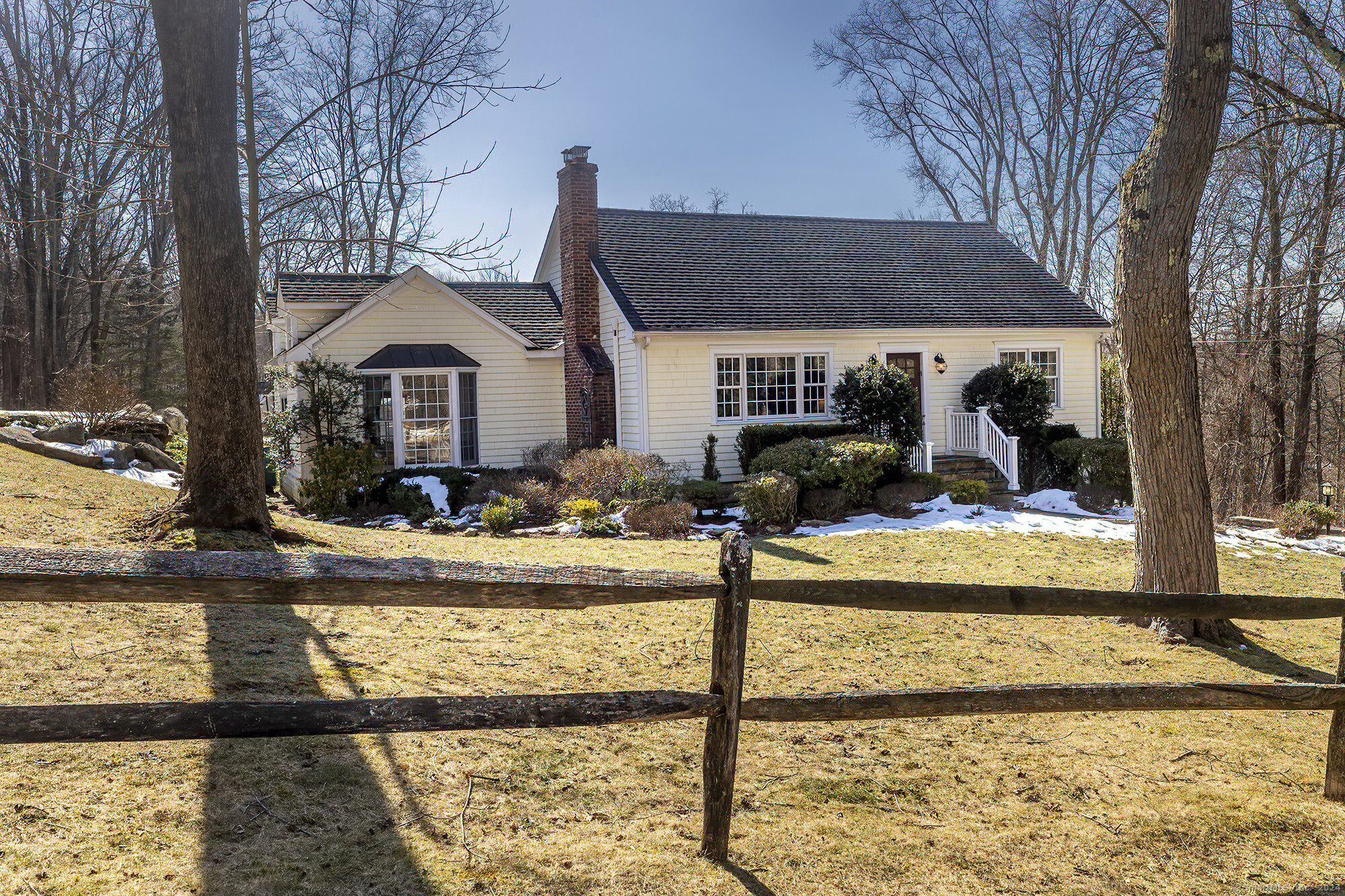 a view of a house with small yard