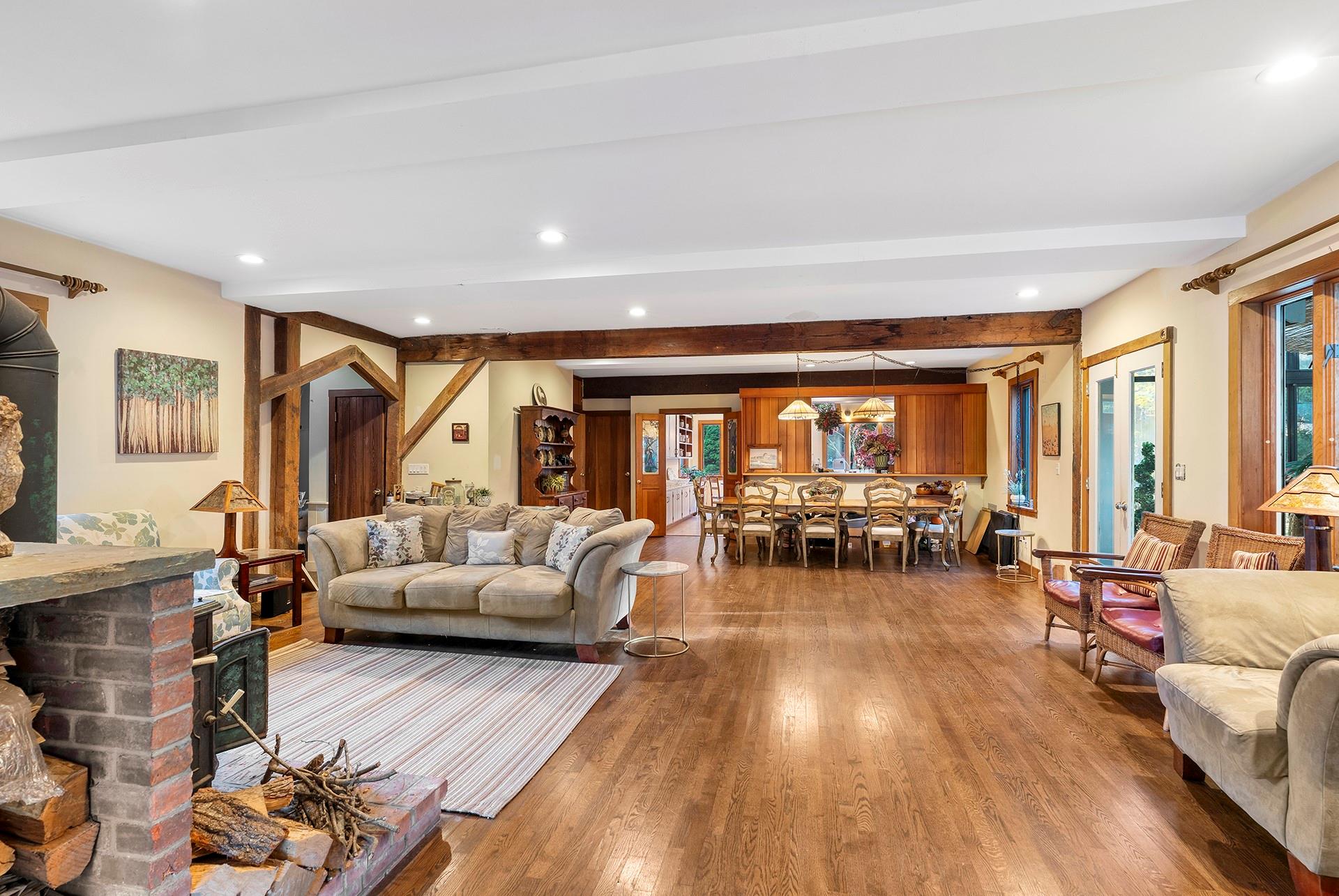 61 Lower 7 Ponds Road Water Mill, NY 11976 - Photo 11 of 43 Living room with hardwood / wood-style floors, beam ceiling, and recessed lighting