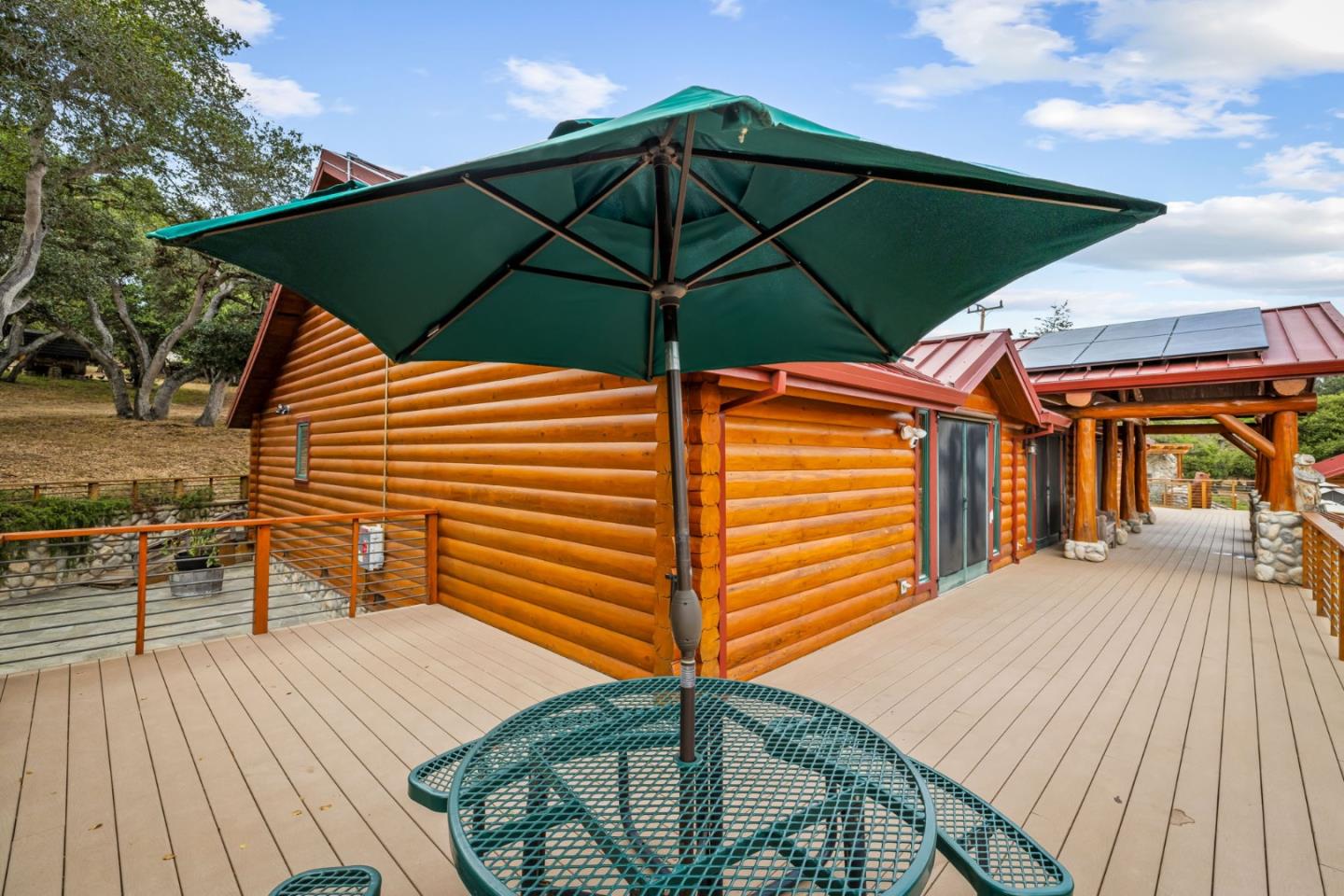 8697 Dyer Road Salinas, CA 93907 - Photo 12 of 94 a view of a patio with table and chairs under an umbrella
