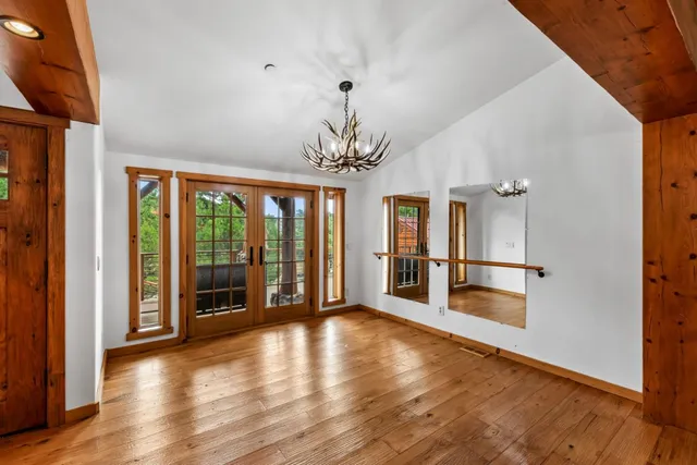 a kitchen with stainless steel appliances granite countertop a refrigerator a stove and a sink