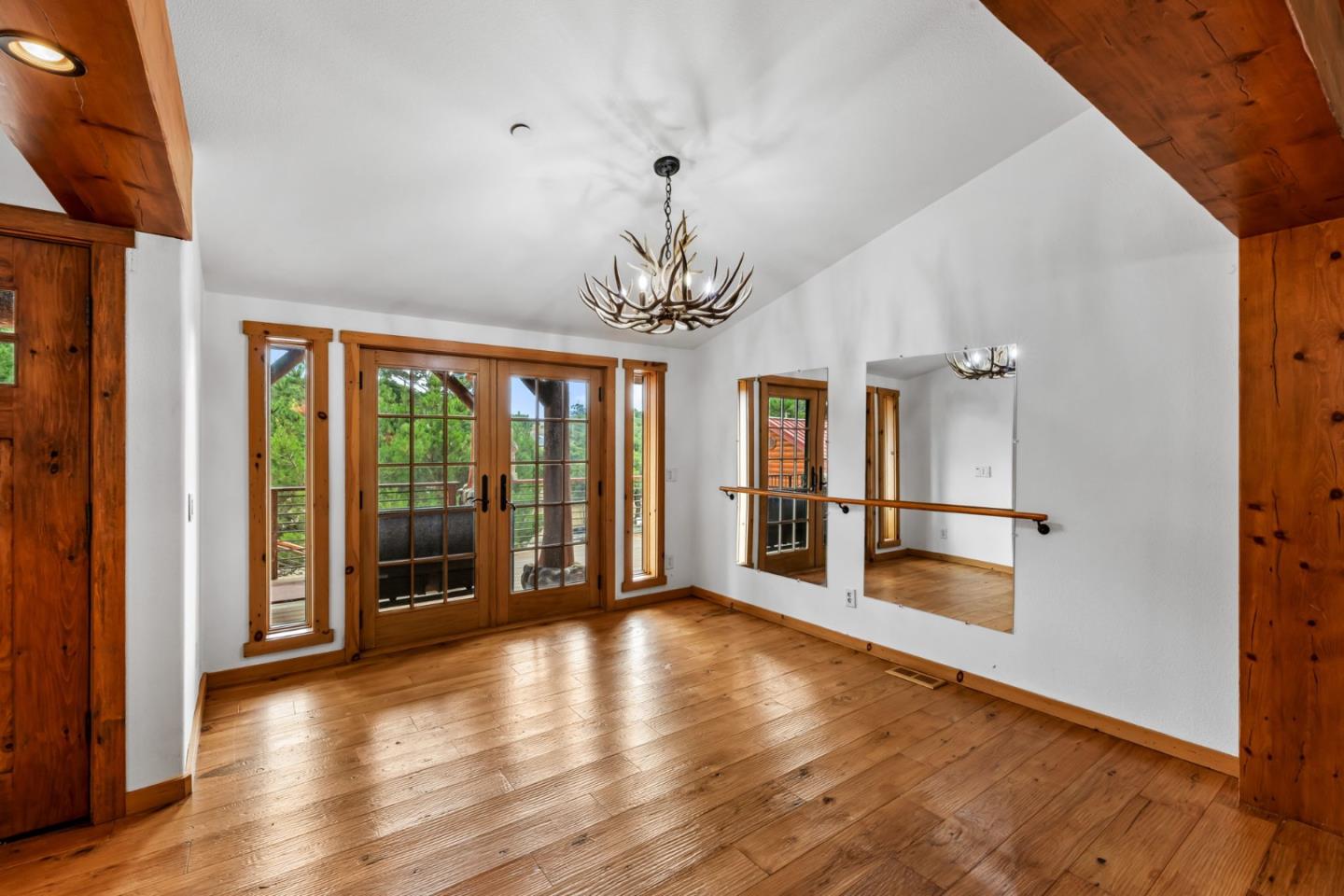 8697 Dyer Road Salinas, CA 93907 - Photo 16 of 94 a view of a big room with wooden floor stairs and a chandelier