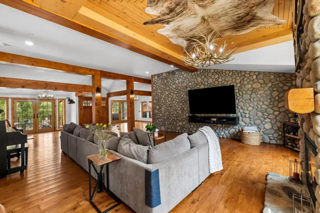 a workspace with furniture window and wooden floor