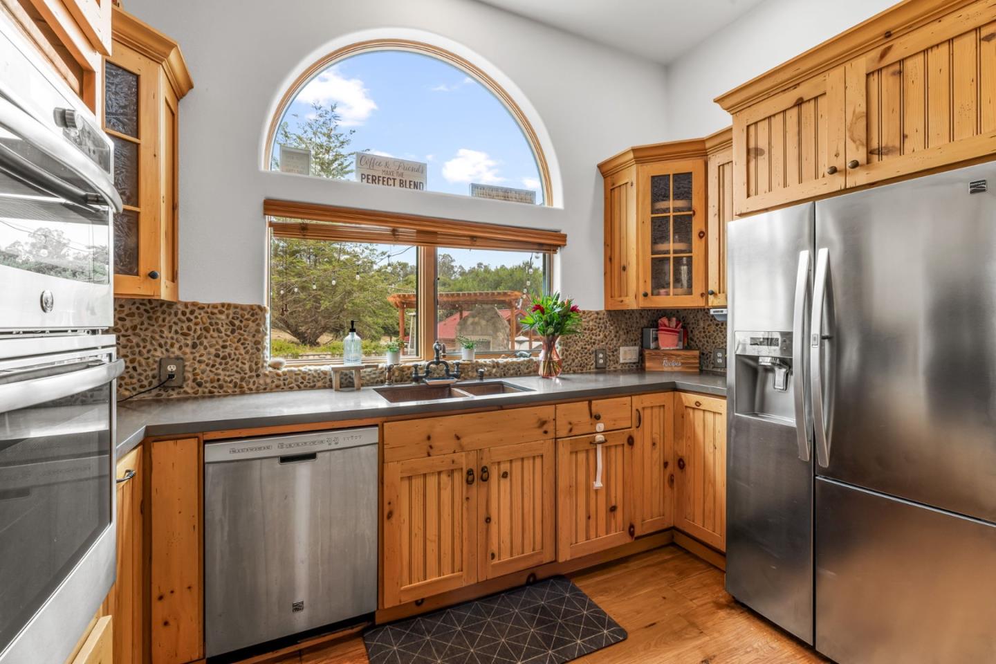 8697 Dyer Road Salinas, CA 93907 - Photo 24 of 94 a kitchen with stainless steel appliances granite countertop a refrigerator a sink a stove and island