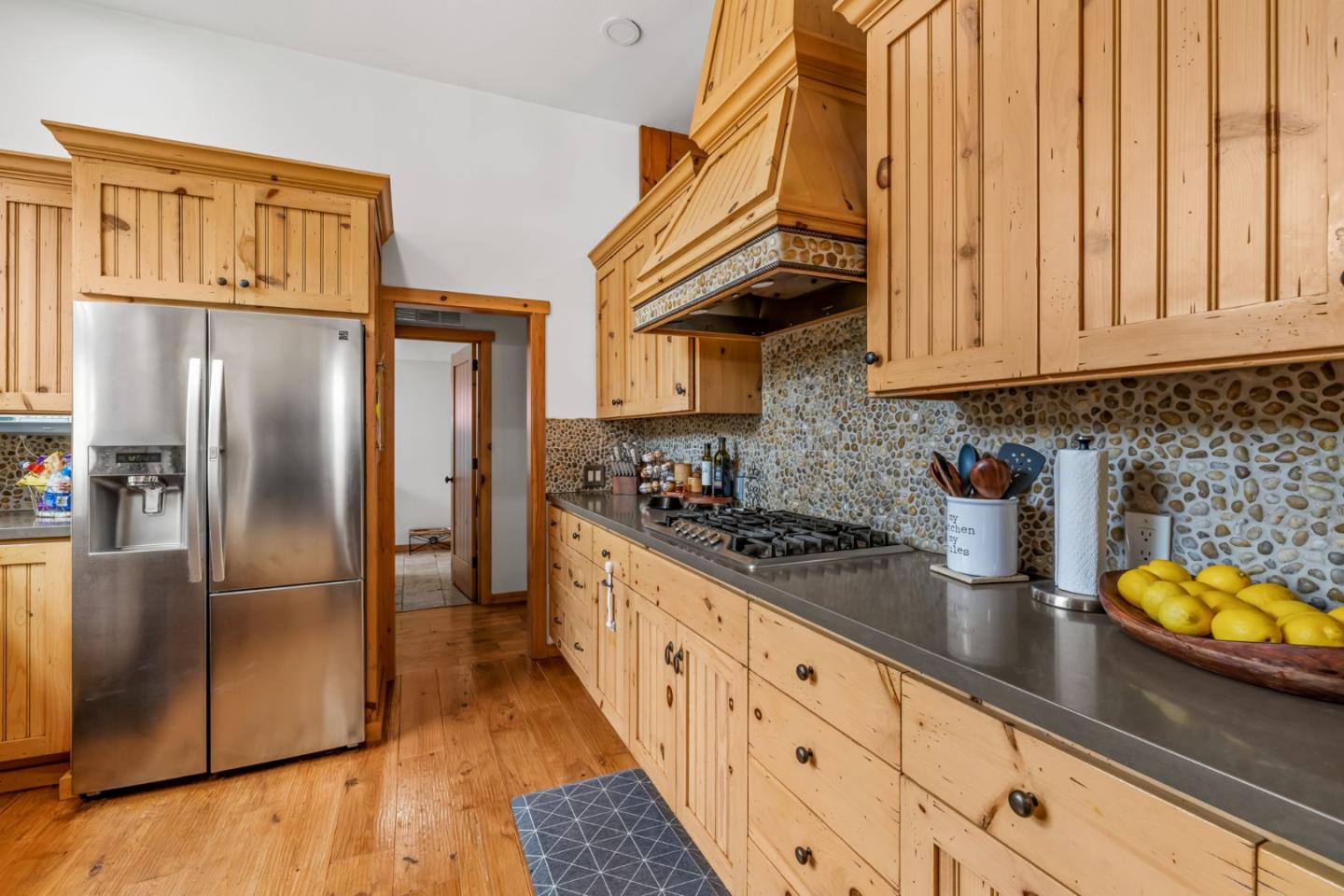 8697 Dyer Road Salinas, CA 93907 - Photo 26 of 94 a kitchen with stainless steel appliances granite countertop a refrigerator a stove and a sink