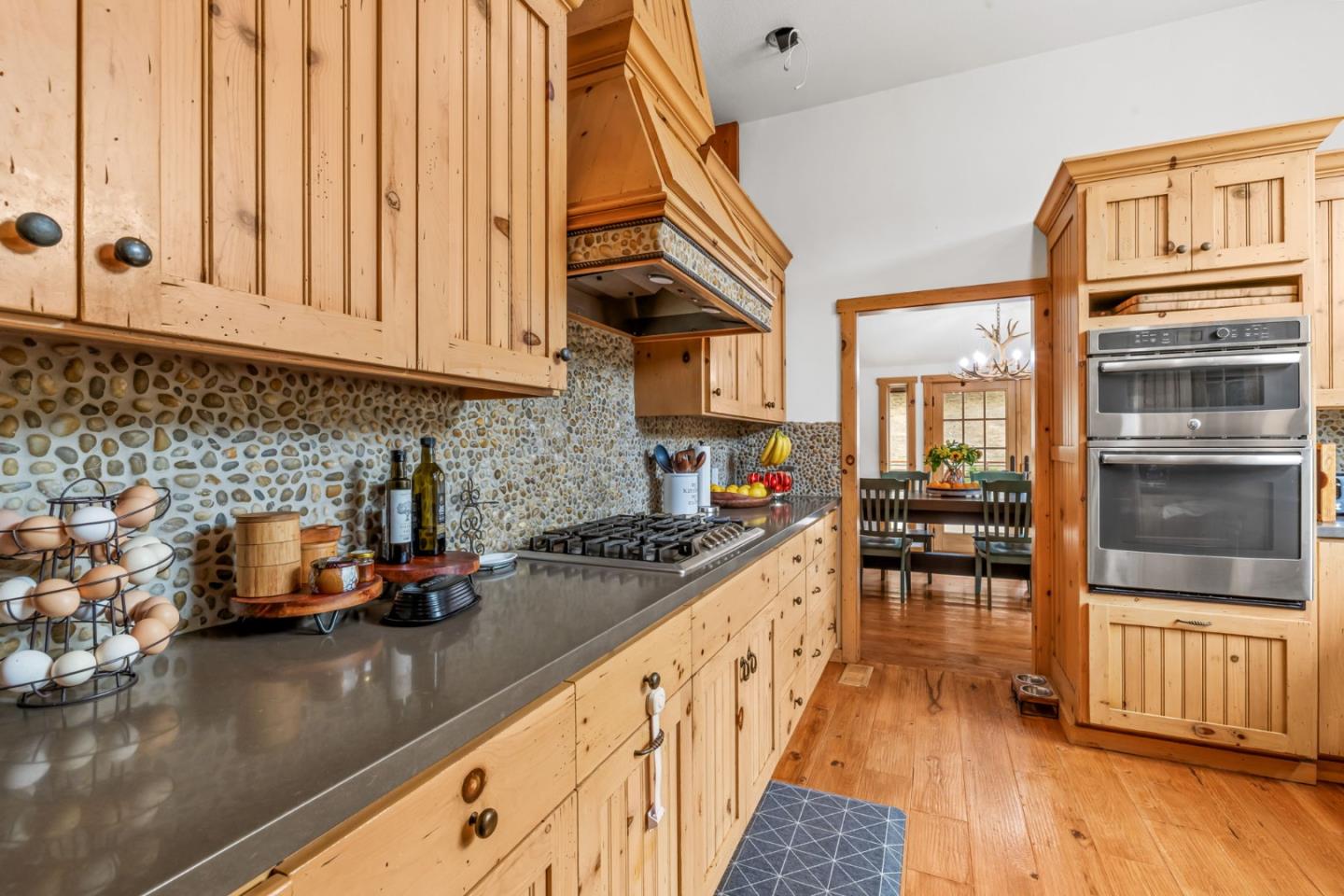 8697 Dyer Road Salinas, CA 93907 - Photo 27 of 94 a kitchen with stainless steel appliances granite countertop a stove a sink and a microwave