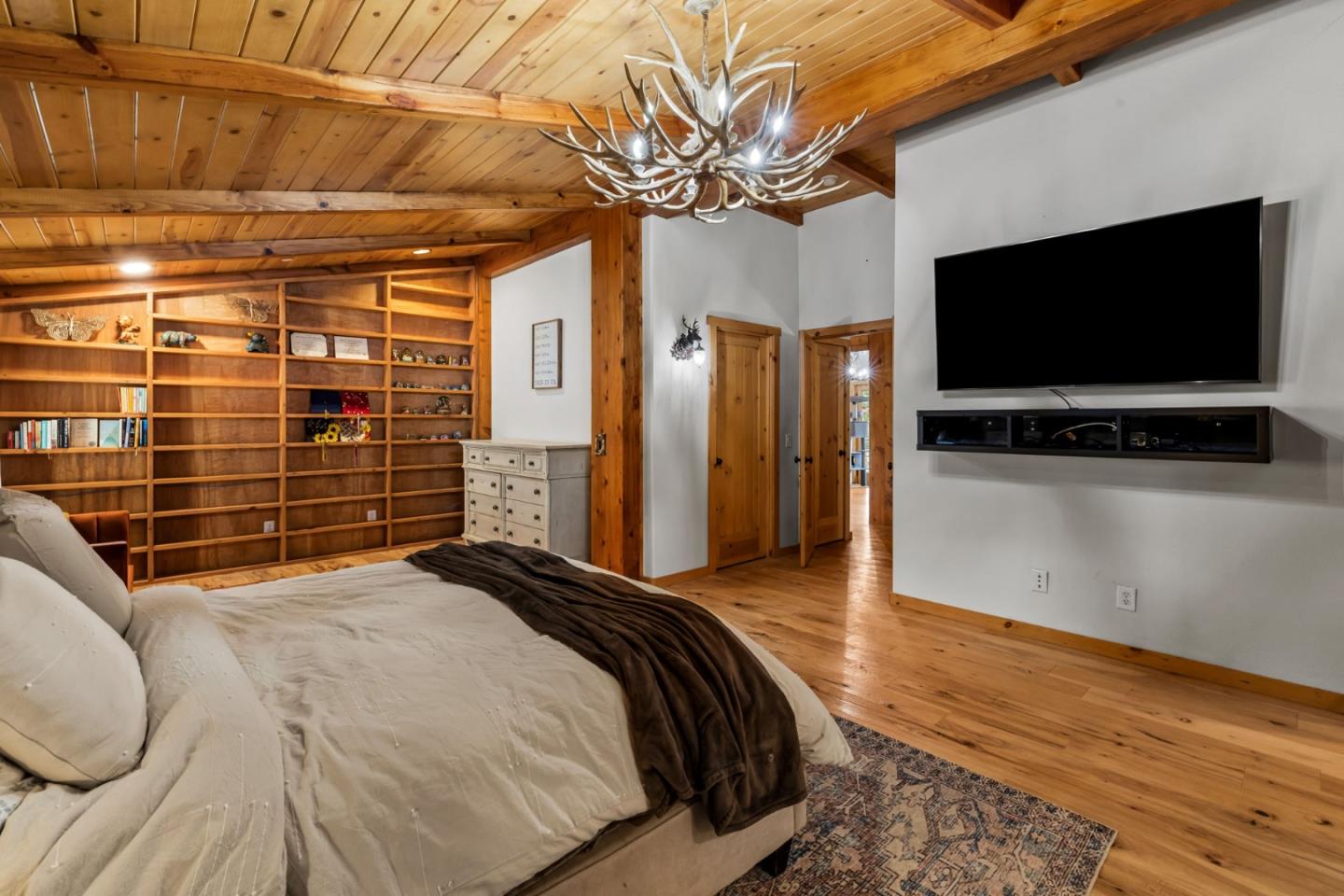 8697 Dyer Road Salinas, CA 93907 - Photo 31 of 94 a bedroom with a bed and a flat screen tv