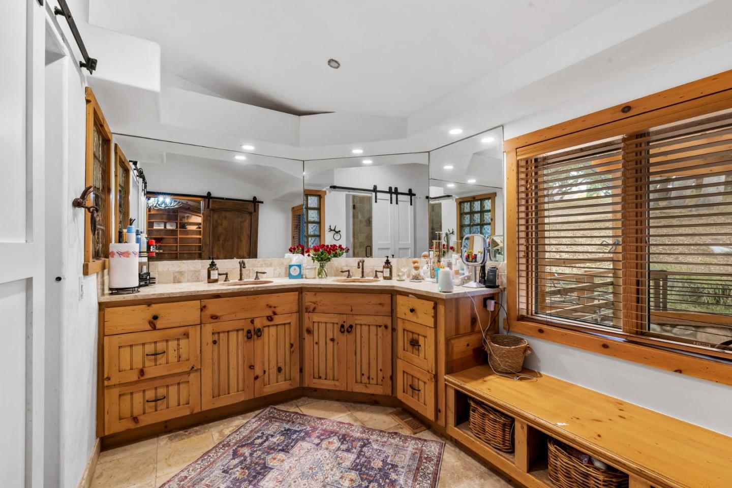 8697 Dyer Road Salinas, CA 93907 - Photo 33 of 94 a spacious bathroom with a double vanity sink a mirror and a bathtub