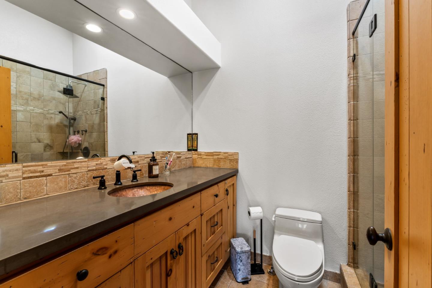 8697 Dyer Road Salinas, CA 93907 - Photo 39 of 94 a bathroom with a granite countertop sink toilet and shower