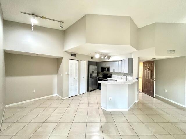 741 North Pine Island Road, Unit 303 Plantation, FL 33324 - Photo 7 of 32 a view of a kitchen with a sink