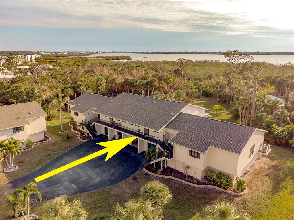 4260 Placida Road, Unit 12C Englewood, FL 34224 - Photo 1 of 57 an aerial view of residential houses with outdoor space