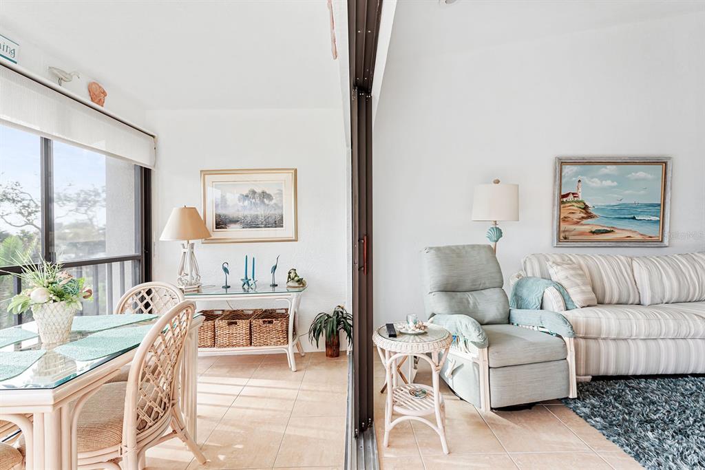 4260 Placida Road, Unit 12C Englewood, FL 34224 - Photo 12 of 57 a living room with furniture and a painting on the wall